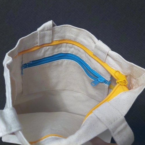 Geniuso TADA funktsionaalne lukkude ja taskutega kandekott 045178G